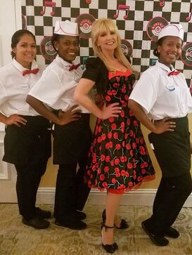 The Chrome 57 band is a 50s band and Oldies band performing in Orlando, Florida and  is pictured at a Grease Theme Band event.